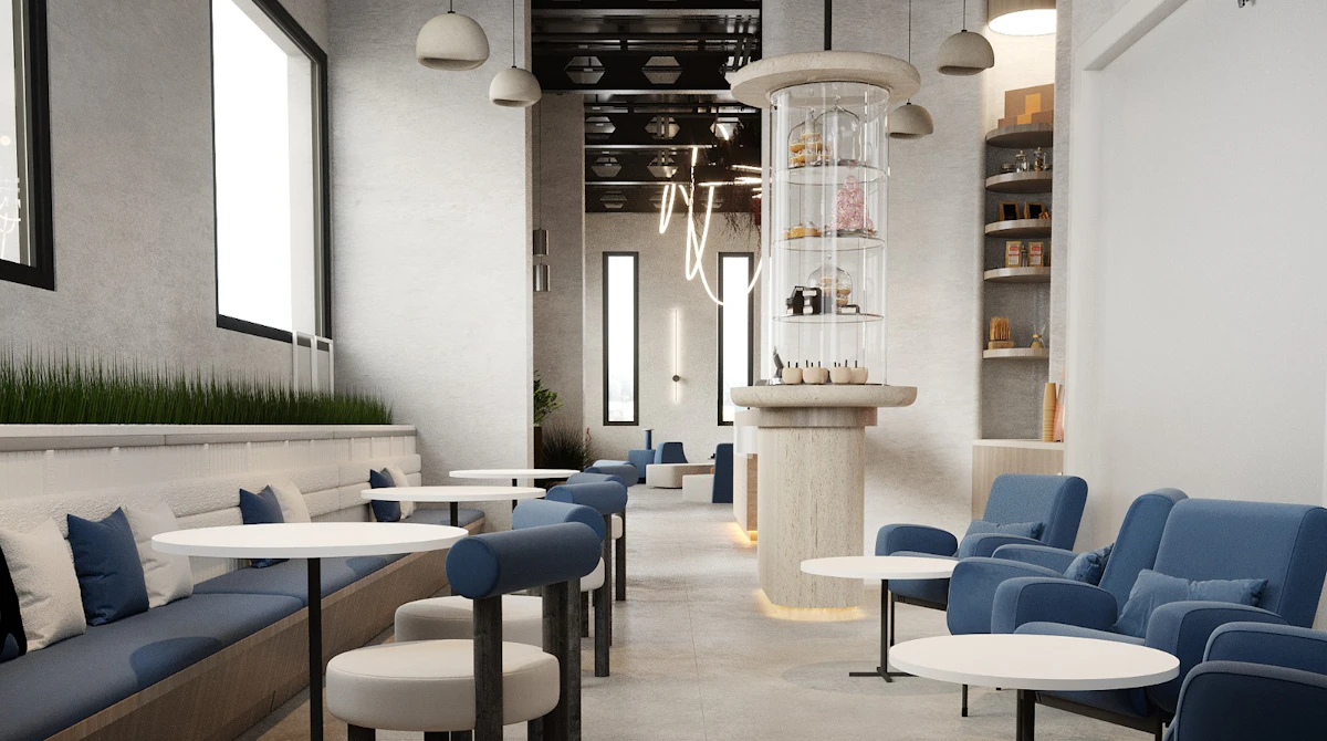 Modern cafe interior featuring sleek blue seating, round white tables, contemporary lighting fixtures, and a minimalist aesthetic with natural light streaming through large windows.
