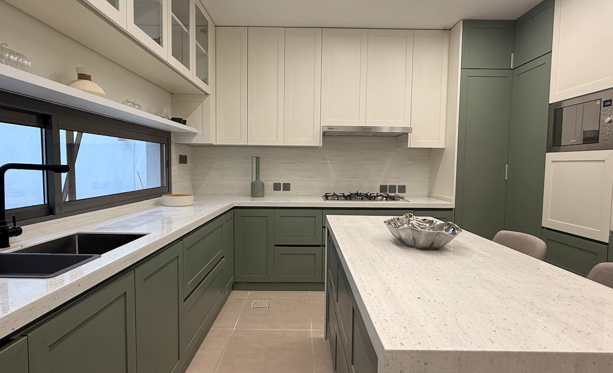 modern kitchen with natural colors between green and whites highlighting the sun entrance