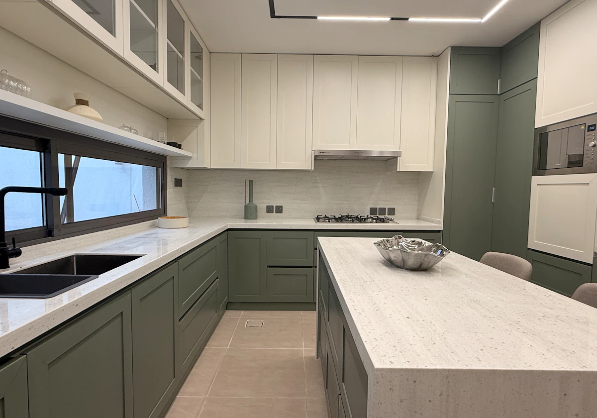 modern kitchen with natural colors between green and whites highlighting the sun entrance