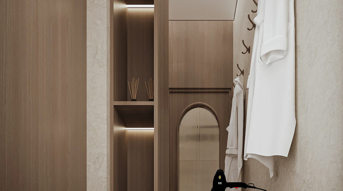 Spa treatment hallway showcasing minimalist architecture, concealed lighting, and refined natural materials.
