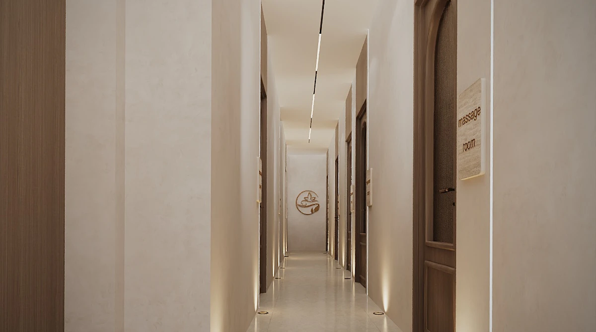 Spa treatment hallway showcasing minimalist architecture, concealed lighting, and refined natural materials.