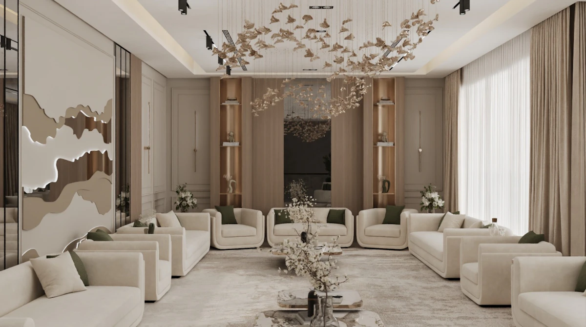 A luxurious living room features plush white sofas arranged in a U-shape around a sleek, marble coffee table, with an intricate, modern chandelier hanging from the ceiling, set against elegant beige wall paneling and large, light-filtering curtains.