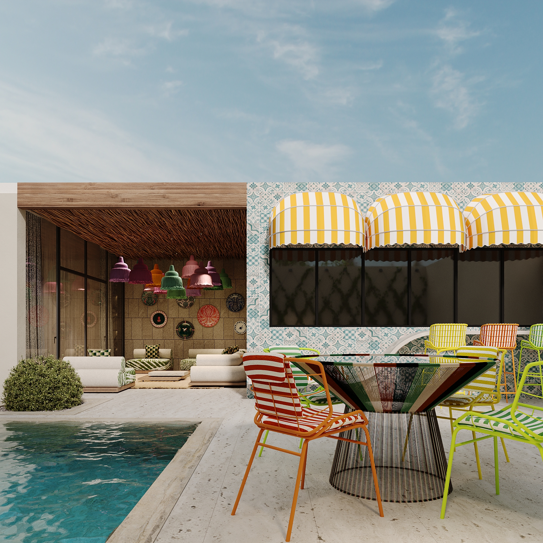 Swimming pool edged with pale travertine paving beside the dining area